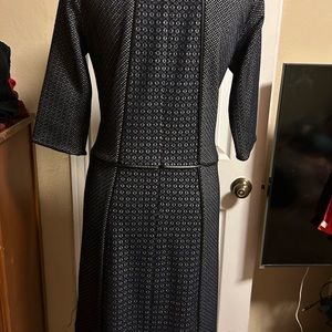 Beautiful black and gray dress with leather details at waist and end of sleeves